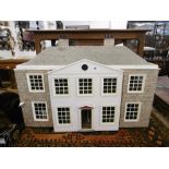 A DOLLS HOUSE WITH FITTINGS