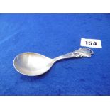 A DANISH SILVER CADDY SPOON