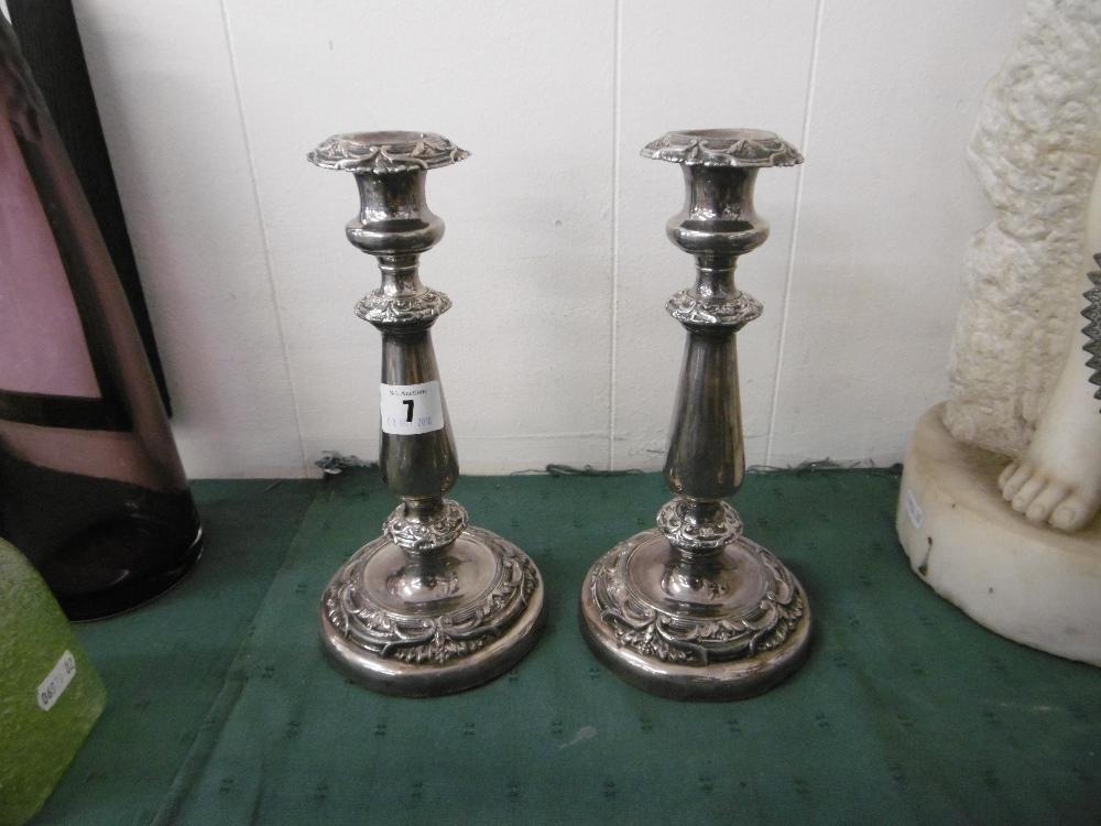 A PAIR OF 19TH CENTURY SILVER PLATED CANDLESTICKS