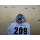 A 14CT GOLD DIAMOND AND EMERALD CLUSTER RING