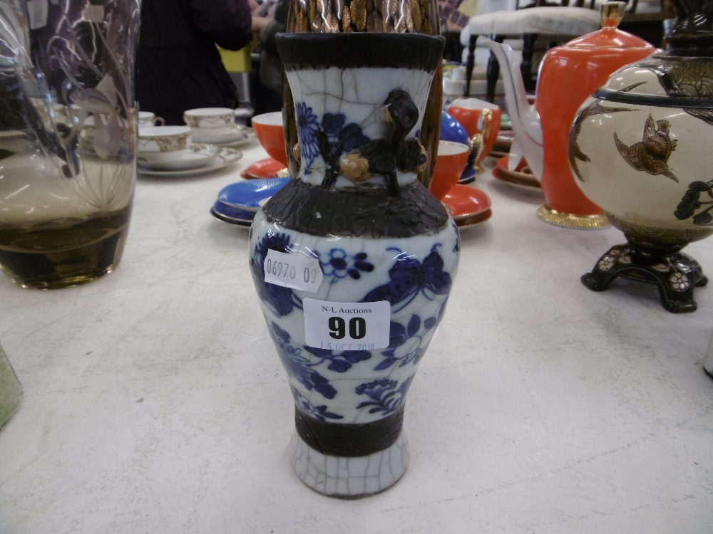 AN ORIENTAL SMALL BLUE AND WHITE VASE A/F - Image 2 of 2