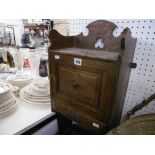 A SMALL OAK WALL CABINET