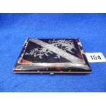 A CONCERTINA TORTOISESHELL SILVER INLAID CARD CASE WITH ADA BLUE SILK LINED INTERIOR,