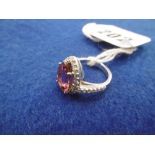 A PLATINUM TOURMALINE AND DIAMOND SET RING SIZE H