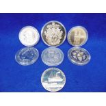 SEVEN ASSORTED COMMEMORATIVE COINS