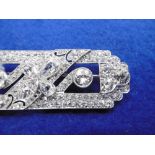 AN ART DECO PLATINUM AND DIAMOND BROOCH APPROXIMATELY 10CT