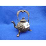 A BRONZE CHINESE CEREMONIAL TEA POT