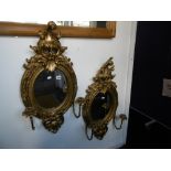 PAIR OF GILT OVAL MIRRORS WITH CANDLEARBRA