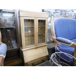 AN OAK BUREAU BOOKCASE