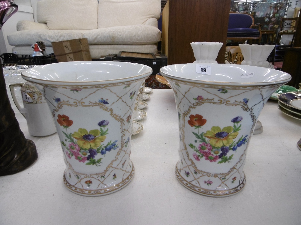 A PAIR OF CONTINENTAL PORCELAIN FLORAL AND GILT VASES