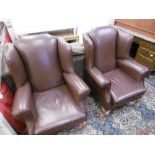 PAIR OF LEATHER UPHOLSTERED WING ARMCHAIRS