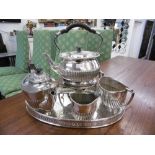 A FOUR PIECE SILVER PLATED TEA SET ON TRAY