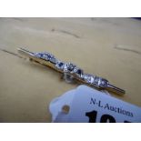 A 9CT DIAMOND AND SAPPHIRE BAR BROOCH