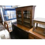 A 19TH CENTURY MAHOGANY BOOKCASE ON CUPBOARD BASE