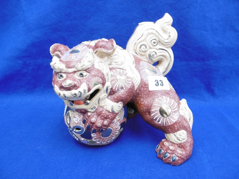 A VINTAGE KUTANI PORCELAIN DOG OF PHO