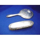 A HALLMARKED SILVER BRUSH AND MIRROR