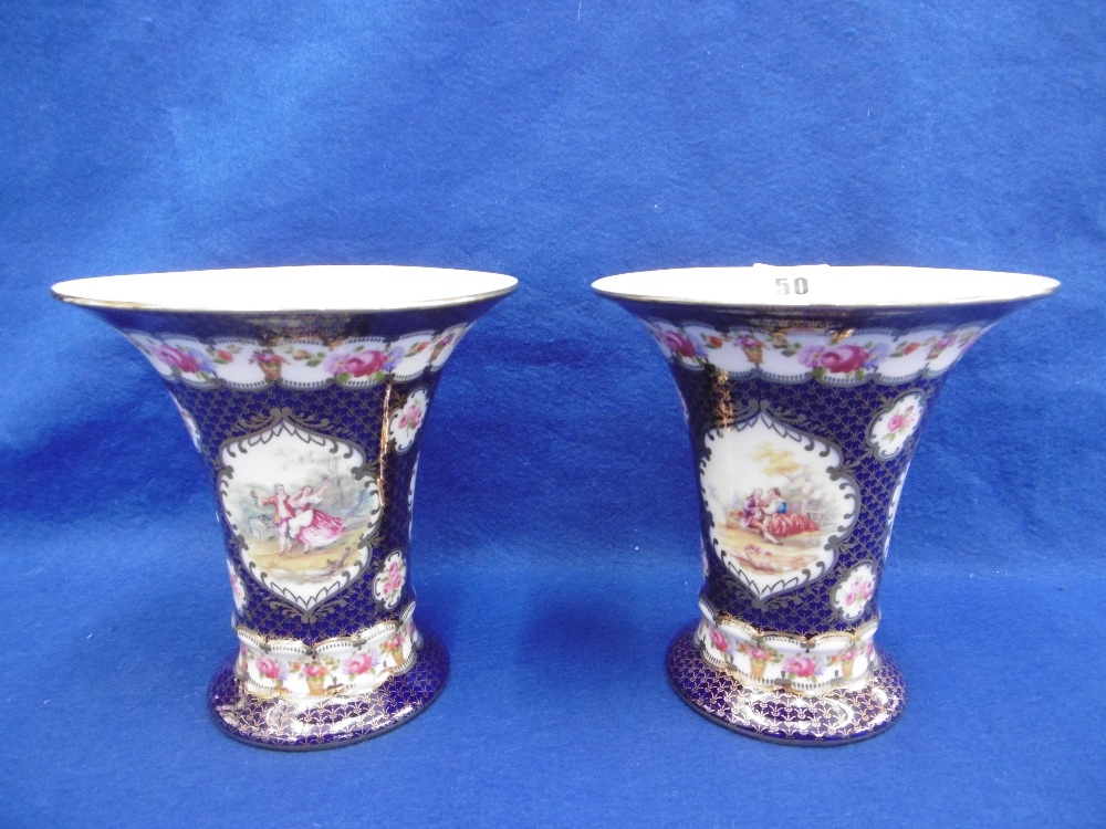 A PAIR OF SEVRES STYLE GILT DECORATED PORCELAIN VASES