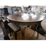 A WALNUT CIRCULAR CENTRE TABLE