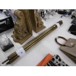 A SET OF BRASS STAIR RODS