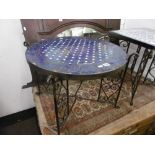 A CIRCULAR IRON MOSAIC TOP TABLE