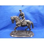 A BRONZE SCULPTURE OF JOCKEY AND HORSE