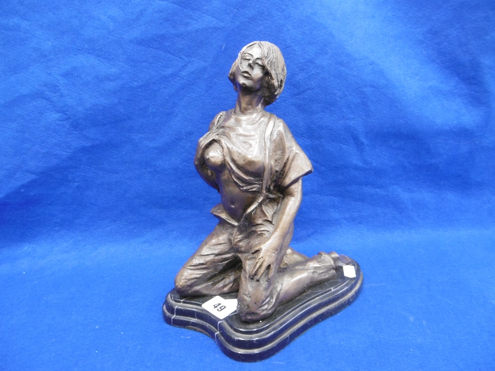 A BRONZE SCULPTURE OF A LADY KNEELING IN AN EROTIC POSE,