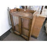 A QUANTITY OF ENCYCLOPEDIAS IN A OAK CABINET