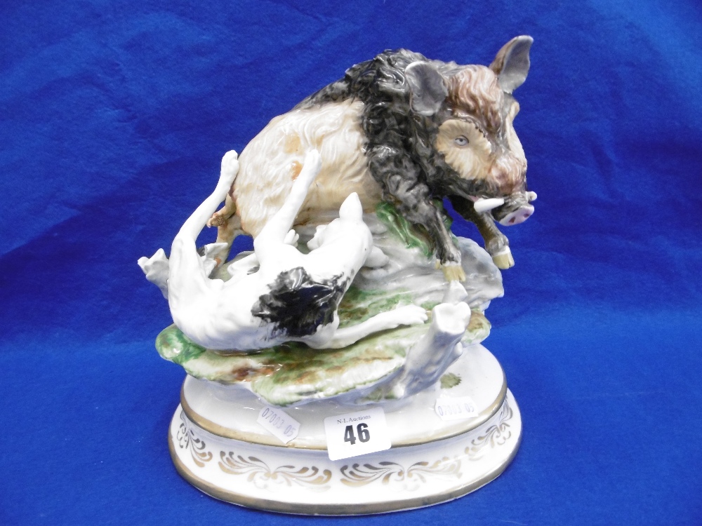 A 19TH CENTURY CONTINENTAL PORCELAIN FIGURE GROUP, WILD BOAR AND HUNTING DOG AFTER MEISSEN,