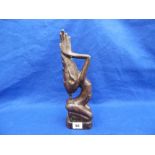 A CAST METAL TRIBAL SCULPTURE