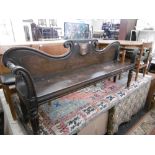 A 19TH CENTURY CARVED OAK BENCH WITH HAND PAINTED ARMORIAL, front left leg has been replaced,