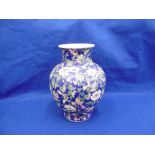 AN ORIENTAL BLUE GROUND VASE