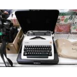 A CASED 1950S OLYMPIA TYPEWRITER