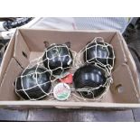 FOUR LAWN BOWLS BALLS WITH MEASURE PLUS THREE TENNIS RACKETS