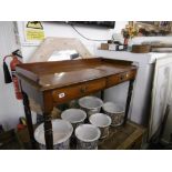 A 19TH CENTURY MAHOGANY TWO DRAWER WRITING TABLE