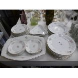 A CONTINENTAL FLORAL DECORATED DINNER SET POSSIBLE LIMOGES