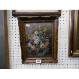 AN OIL ON BOARD STILL LIFE OF FLOWERS SIGNED