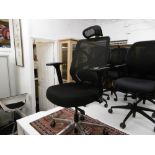 AN OFFICE CHAIR WITH HEAD REST