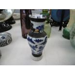 AN ORIENTAL SMALL BLUE AND WHITE VASE A/F