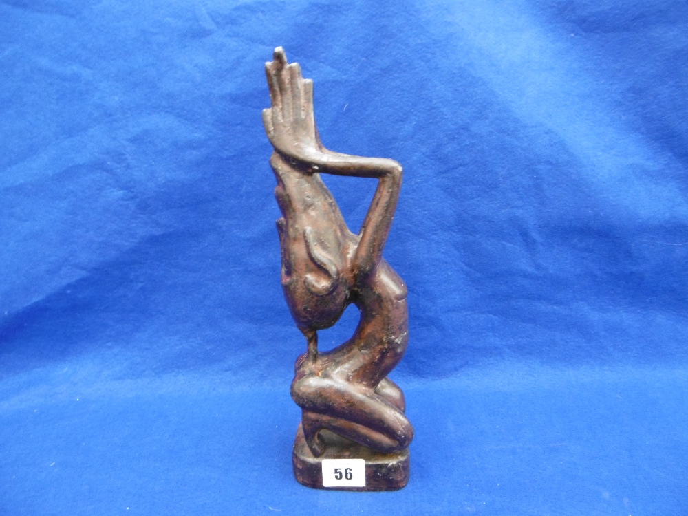 A CAST METAL TRIBAL SCULPTURE