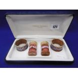 A BOXED 'CORNISH OF HELSON' ENAMEL NAPKIN RINGS,