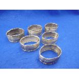 SIX STERLING NAPKIN RINGS