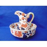 A DECORATIVE JUG AND BOWL SET