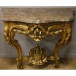 CONSOLE EN BOIS DORE LOUIS XV En bois doré et sculpté, galbée en façade et sur [...]