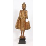 BOUDDHA DEBOUT" BIRMANIE Buddha debout vétu de sa robe monastique déployée . Bois [...]