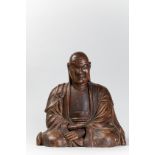 Arhat disciple du Bouddhisme Theravada assis en méditation, les mains croisée vêtu [...]