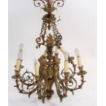 LUSTRE "AUX PUTTI" A HUIT LUMIERES En bronze doré, à quatre paire de bras de [...]