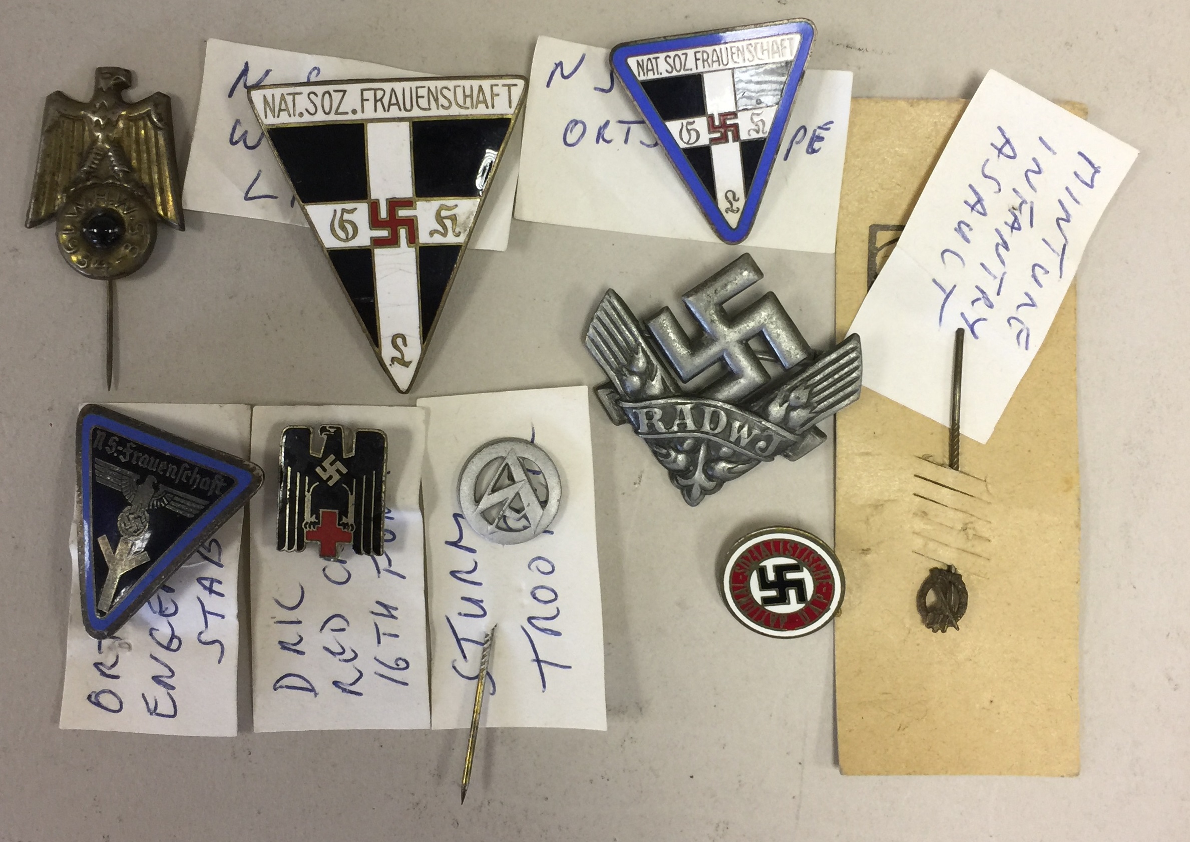 THIRD REICH. 9 assorted badges to include: a stormtrooper badge, a RADWJ badge, an Ortsgruppe badge.