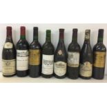 MIXED RED WINES. Eight bottles of red wine, most with good levels and firm capsules.