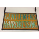 BARBER'S SIGN. A cast iron and glass original hanging sign. Measures approx 78 x 58cm.