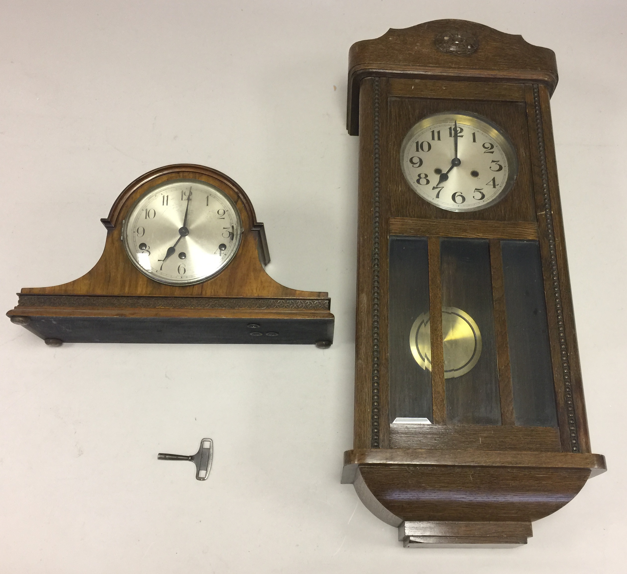 PAIR OF CLOCKS. An art deco style mantle clock with 'Westminster' chimes, marked 'Foreign' to face.